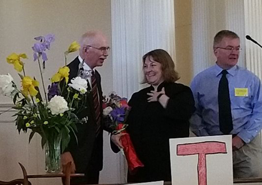 Phil Jones, president, calls Diana to be our new minister. Search Committee chair Ray Dodge assists.